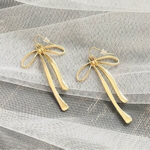Bow gold hanging earrings oversized coquette